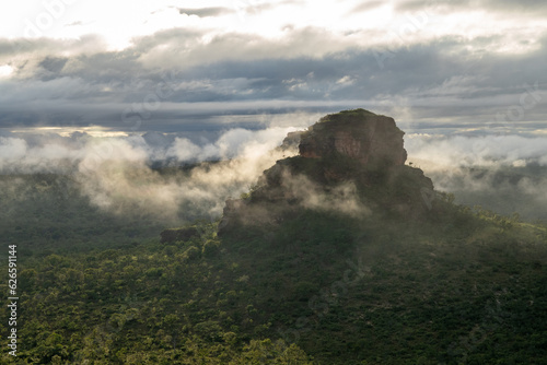 Beautiful sandstone hill covered by morning mist © Rodrigo