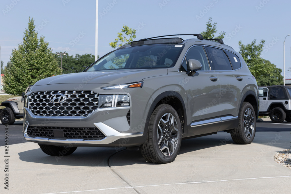 Hyundai Santa Fe Hybrid display at a dealership. Hyundai offers the