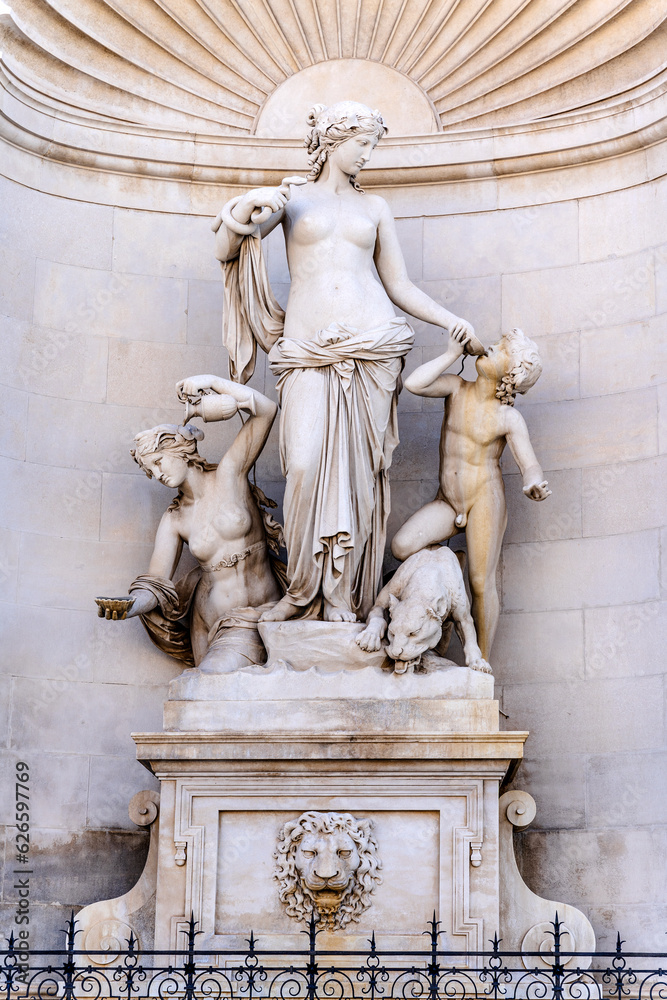 Fountain with allegorical sculpture of fresh water in the form of Thetis from Greek mythology, in the left corner of the facade of Lloyd Triestino Palace, piazza Unità d'Italia, Trieste, Italy