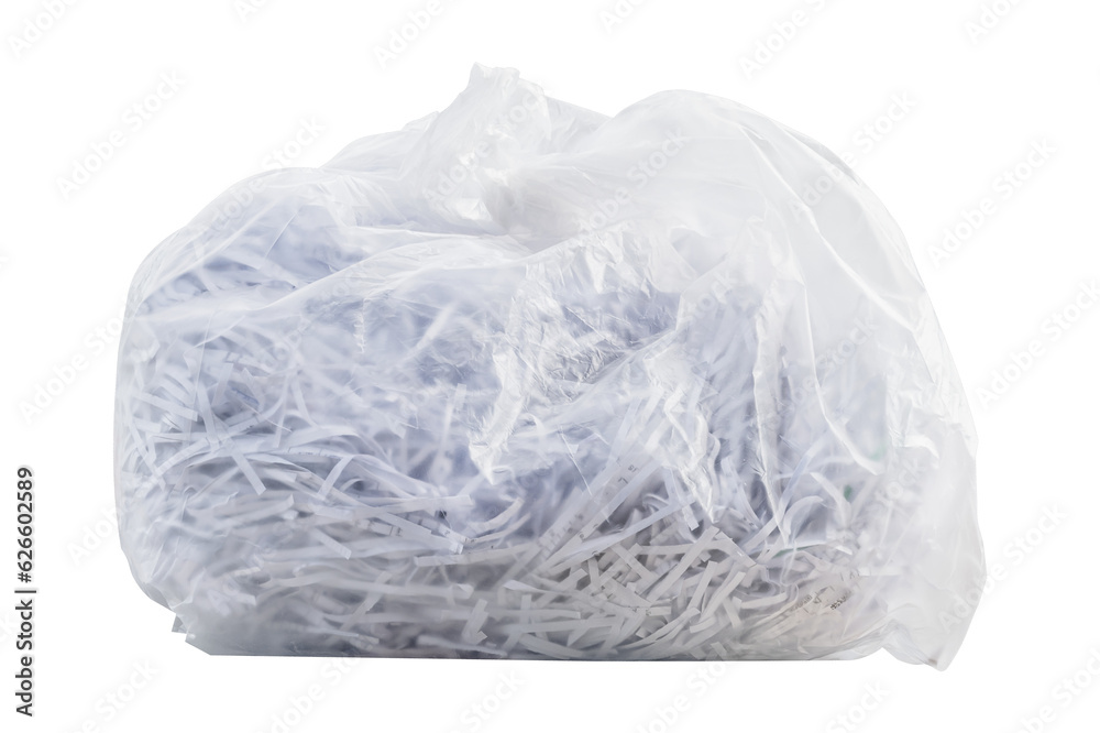 Shredding paper in white garbage bag
