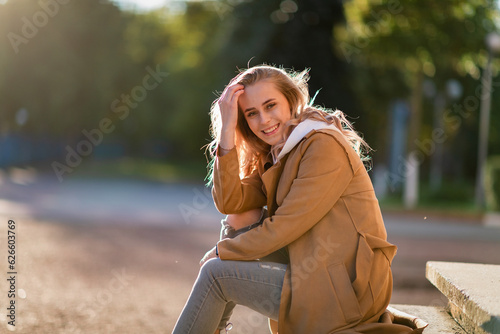 Portrait of a young beautiful fair-haired girl in the autumn park. © shymar27