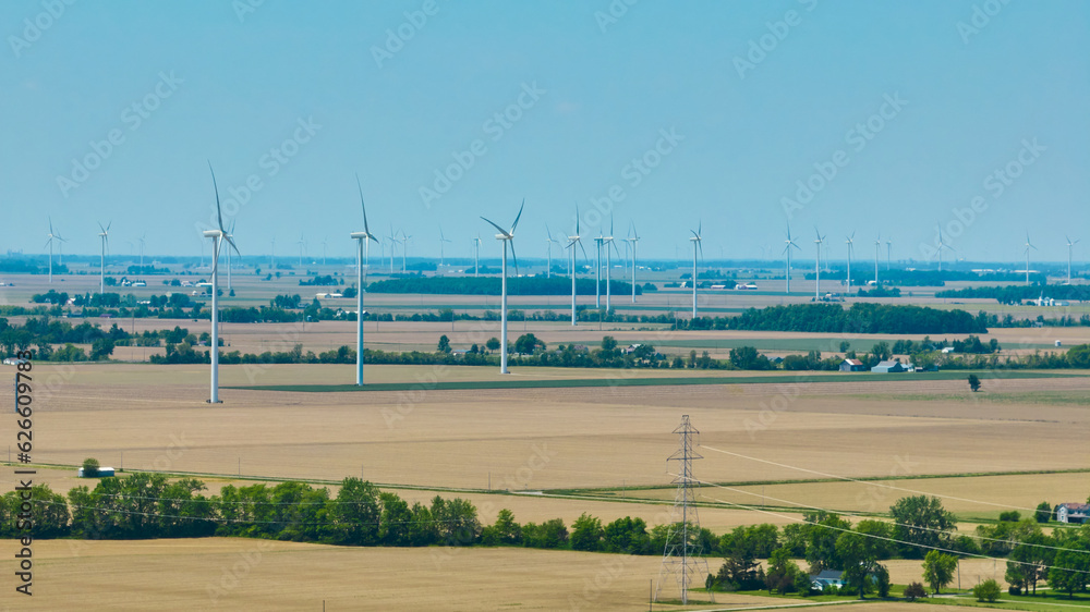 Wind farm aerial with power lines on summer day Wind farm aerial with power lines on summer day