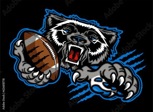 mean wolverine mascot holding football for school, college or league