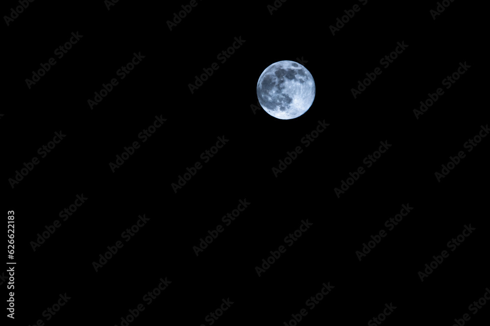 Full moon in front of clear dark sky over hamburg, germany, 2023, horizontal format Full moon in front of clear dark sky over hamburg, germany, 2023, horizontal format