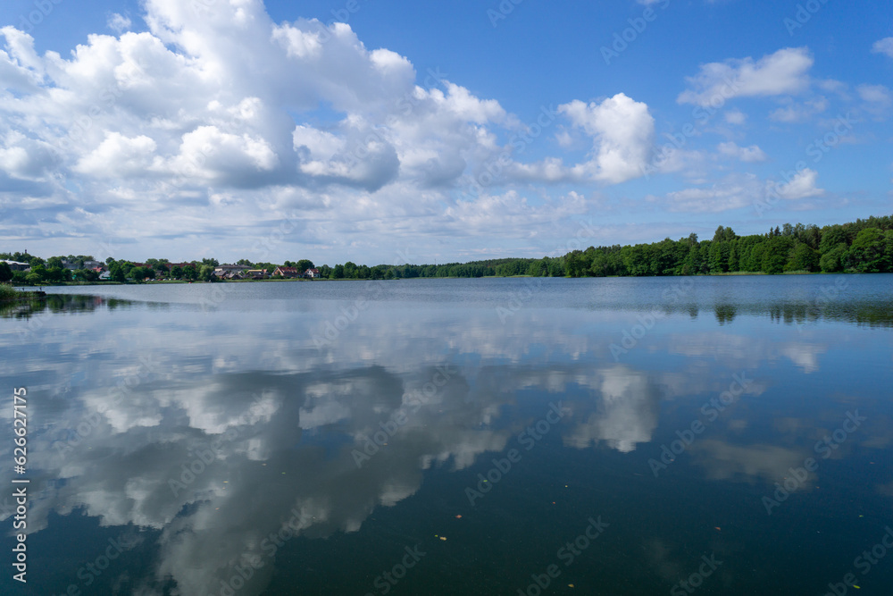 Lakes of the city of Trakai in Lithuania, with the sky reflected in the water of the lake.