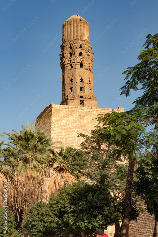 Minaret of historic Mosque of al-Hakim, known as Al-Anwar, named after Al-Hakim bi-Amr Allah. Inside the Fatimid gate; Bab al-Futuh in Islamic Cairo, Egypt.