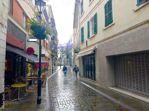 Fototapeta Naklejka Na Ścianę i Meble -  famous Main Street with beautiful buildings in Gibraltar on a rainy day, 2023, British Overseas Territory, United Kingdom, Europe