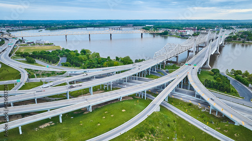 Aerial Louisville suspended highway road system lading to bridges over Ohio River Indiana side