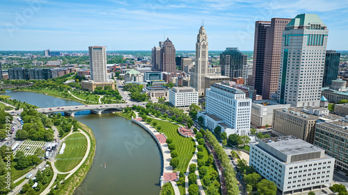 Downtown Columbus Ohio skyscrapers with Scioto River and green promenade and greenway aerial