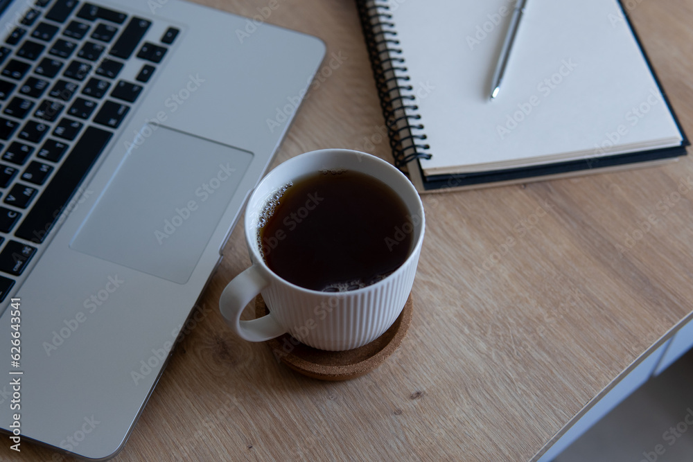 cup of coffee and laptop cup of coffee and laptop