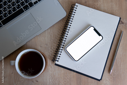 cup of coffee and notebook and laptop