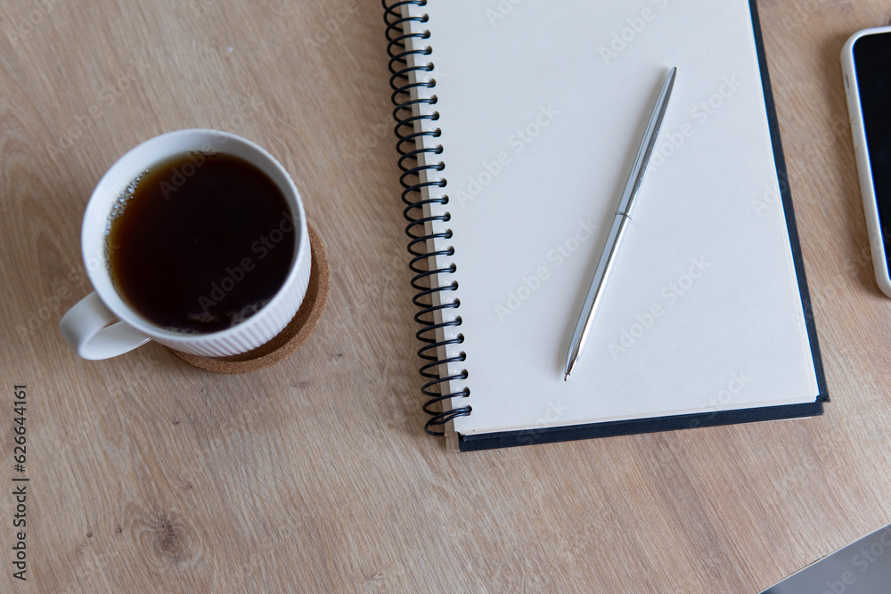cup of coffee and notebook cup of coffee and notebook