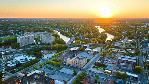Sunrise horseshoe shaped river with bridge and train city landscape aerial downtown USA