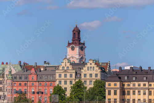 The church Storkyrkan and old houses in the island Gamla Stan, a sunny summer day in Stockholm