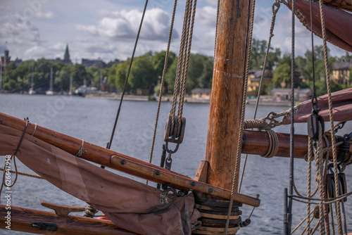 Rigging details on an old sailing boat boom, a sunny summer day in Stockholm