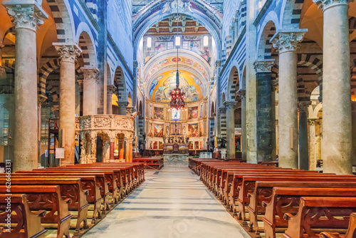 Pisa, Italy - May 17, 2023: Interior of the Duomo in Pisa, Romanesque Nave of Pisa cathedral Tuscany, Italy