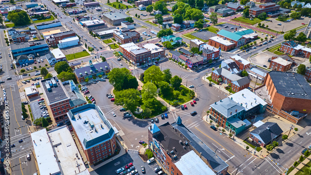 Cars driving around green park at center of city of Mount Vernon Ohio aerial Stock Photo Adobe