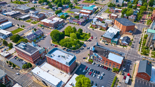 Aerial small town Mount Vernon with green park in center and parking lots