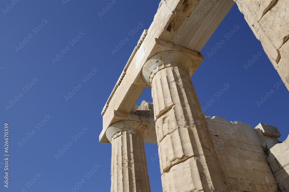 Old ancient restored Greek building with columns and roof in ancient Athens museum on a blue sunny sky, Greece Old ancient restored Greek building with columns and roof in ancient Athens museum on a blue sunny sky, Greece