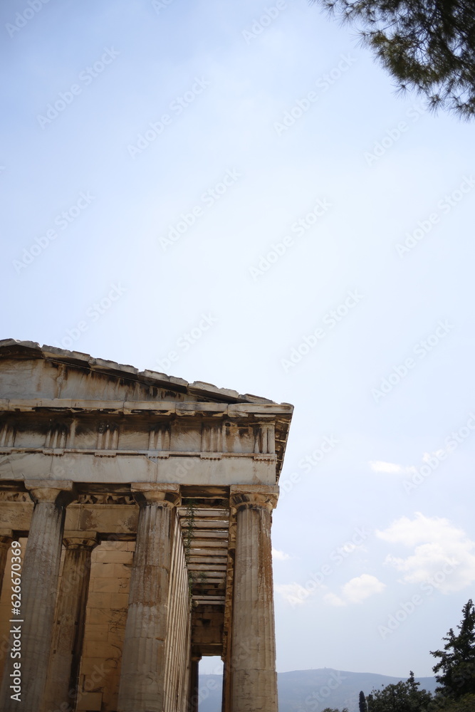 Old ancient restored Greek building with columns and roof in ancient Athens museum on a blue sunny sky, Greece Old ancient restored Greek building with columns and roof in ancient Athens museum on a blue sunny sky, Greece