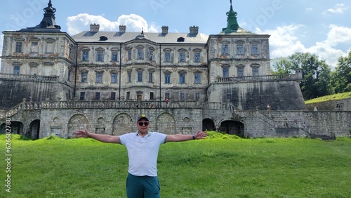 Old castle near Lviv. Podgoretsky castle. A man in front of an old castle. Castles of Ukraine photo