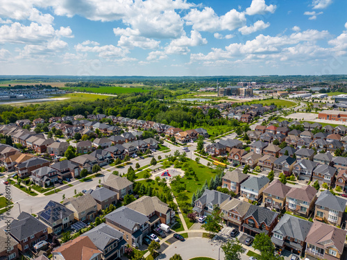 Discover the essence of picturesque living in Stouffville, Whitchurch-Stouffville, Ontario, through captivating drone photos of a residential area. Blue skies and green grass of summertime accentuate 