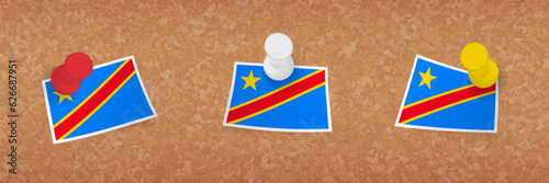 DR Congo flag pinned in cork board, three versions of DR Congo flag.
