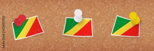 Congo flag pinned in cork board, three versions of Congo flag.
