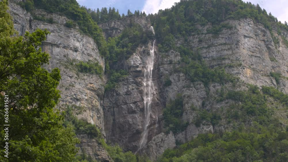 Waterfall in the mountains. Water falls from the rocks high in the mountains. Seerenbach Falls, Betlis, Amden, Walensee. Canton of St. Gallen, Switzerland. Waterfall in the mountains. Water falls from the rocks high in the mountains. Seerenbach Falls, Betlis, Amden, Walensee. Canton of St. Gallen, Switzerland.