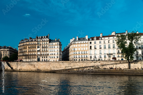 Paris, France. April 24, 2022: City architecture with houses and Seine river view © camaralucida1