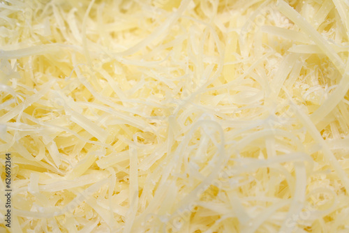 close up of food. close up of cheese. grated cheese texture. cheese details.