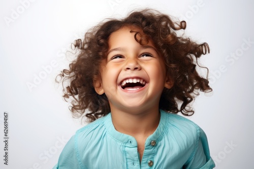 a professional portrait studio photo of a cute mixed race boy child model with perfect clean teeth laughing and smiling. isolated on white background. for ads and web design. Generative AI photo