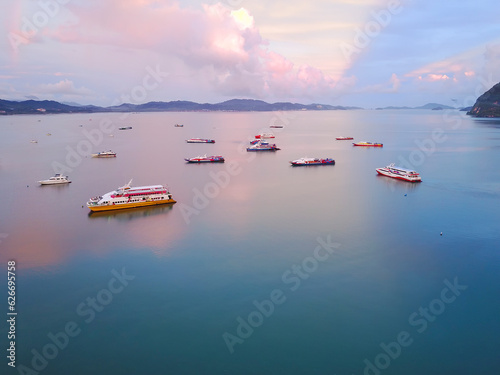 Aerial view of a Lighthouse, boat and yatches docked in marina, Langkawi.