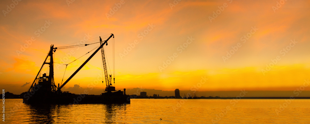 Industry landscape on sunset Engineering shipping crane depot at logistic export terminal control. Silhouette Warehouse freight background container yard loading quayside harbor port with copyspace