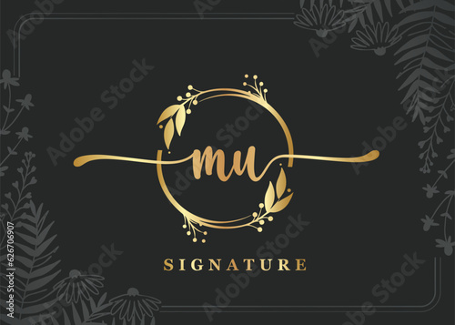 luxury gold signature initial mu logo design isolated leaf and flower photo