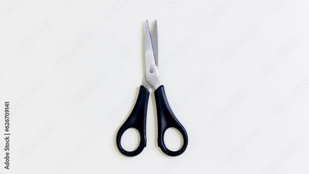 Scissors open and close continuously Scissors open and close continuously