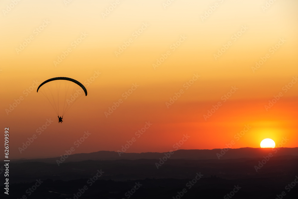 Paragliding during sunset. Pedra Grande, located in Atibaia, Brazil