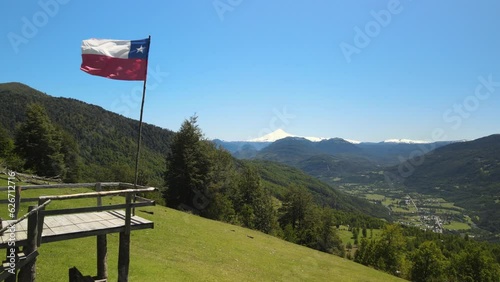 Drone view of Chilean flag and Villarica volcano in the beginning of route to Heart lagoon laguna corazon in Chile.
