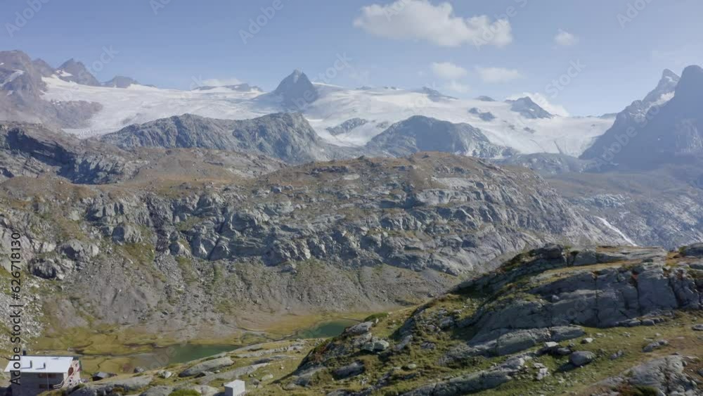 small house surrounded by mountains and glacier Aosta walley small house surrounded by mountains and glacier Aosta walley