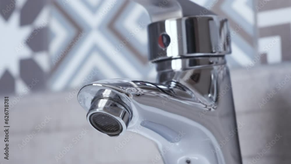 Water dripping from faucet tap at Bathroom Water dripping from faucet tap at Bathroom