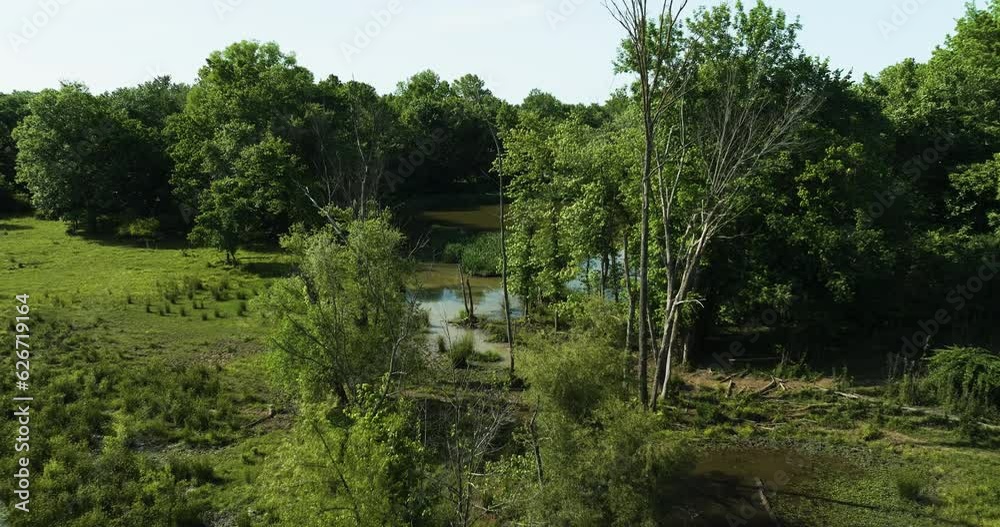 Lake Sequoyah Surrounded By Greenery In Rural Landscape Of Fayetteville In Arkansas, USA. wide aerial Lake Sequoyah Surrounded By Greenery In Rural Landscape Of Fayetteville In Arkansas, USA. wide aerial