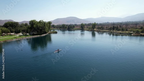 Man kayaking on lagoon Piedra Roja in Chicureo Santiago Chile photo