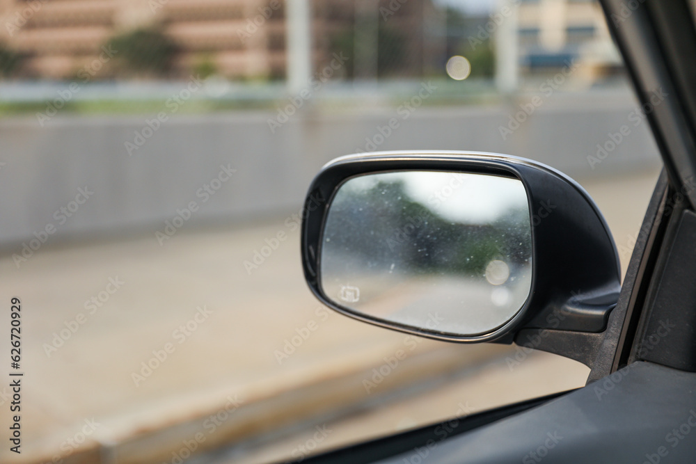 Car mirror reflects life's journey, symbolizing reflection, hindsight, self-awareness, and the road ahead. Metaphor for introspection Car mirror reflects life's journey, symbolizing reflection, hindsight, self-awareness, and the road ahead. Metaphor for introspection