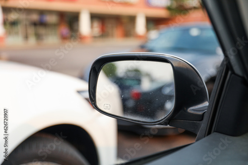 Car mirror reflects life's journey, symbolizing reflection, hindsight, self-awareness, and the road ahead. Metaphor for introspection