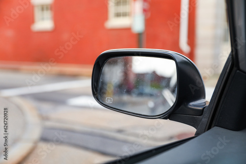 Car mirror reflects life's journey, symbolizing reflection, hindsight, self-awareness, and the road ahead. Metaphor for introspection © Your Hand Please