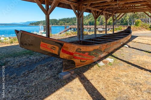 Traditional canoe of the We Wai Kai first nation native people in the village of Cape Mudge on Quadra Island, Canada. photo