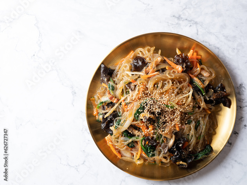 japchae, mixed dish of boiled bean threads, stir-fried vegetables, and shredded meat photo