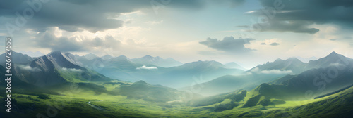 beautiful picturesque panoramic mountain valley landscape with hills fields mist and clouds in sky