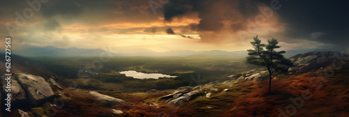 beautiful dramatic panoramic sunset over the mountains with cloudy sky