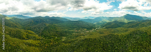 Valley of the Mountain River Shepsi among the Green Forest of the mountains of the Western Caucasus off the coast of the Black Sea Air panorama on a sunny summer day © Alexei Merinov